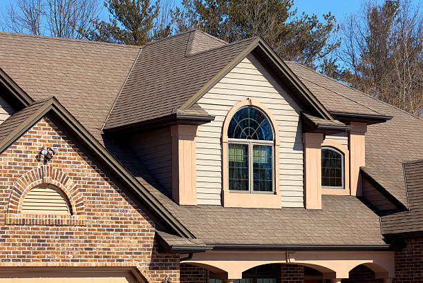 istock House With Brick, Vinyl Siding, Half-Round Windows, Stucco Accents 157582303