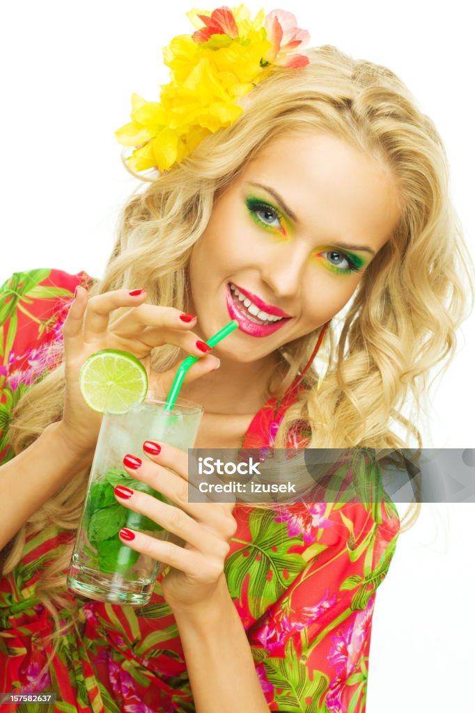 Summer portrait of a beautiful blonde woman drinking tropical drink  20-24 Years Stock Photo
