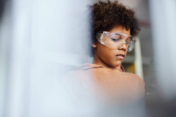 istock Little black scientist working in laboratory. 1575826811