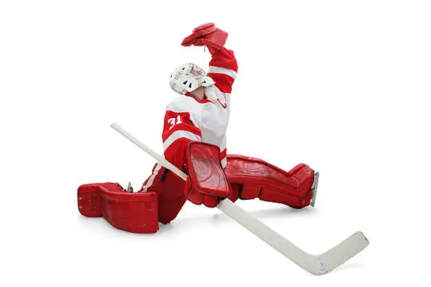 Hockey goalie making fantastic glove save.