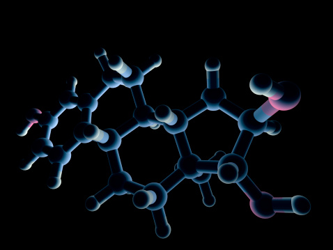 A model of a molecule of estriol, one of several estrogen steroid hormones produced by the sex glands in mammals.  Isolated on black.