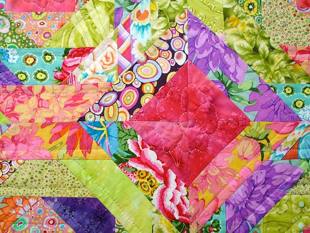 Quilt made with colorful squares Colorful Quilt made from floral patterns and square shapes duvet stock pictures, royalty-free photos & images