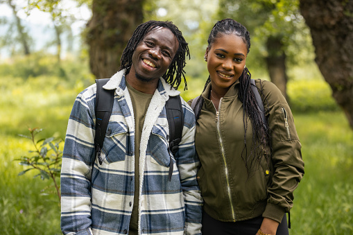Portrait of a young African couple in a forest