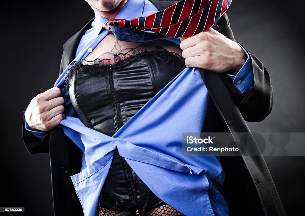 Drag Superhero Man ripping open his shirt like a superhero, revealing drag clothing underneath. Adult Stock Photo