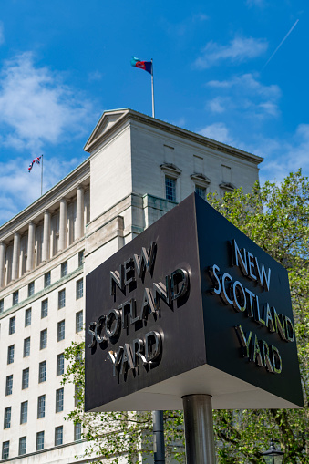 London, UK - The famous revolving sign outside New Scotland Yard, the headquarters