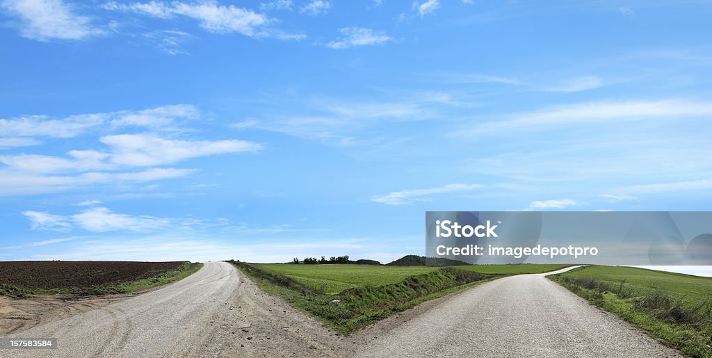 empty forked road Forked Road, country road split from each other to different directions. Forked Road Stock Photo