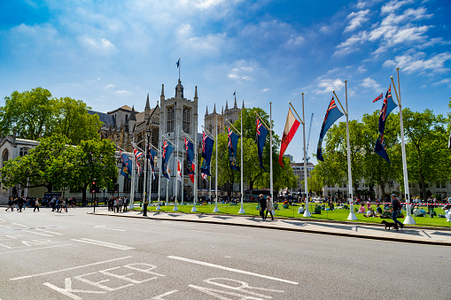 St Margaret's Street and Parliament Square with Westminster Abbey in the background. London, UK.