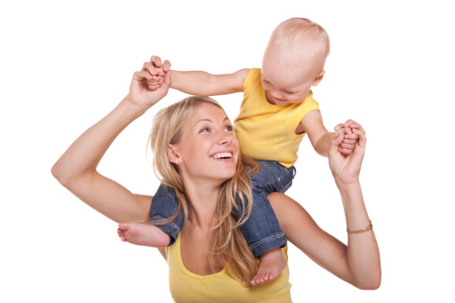 Mother and baby having fun. Copy space on left. SIMILAR IMAGE YOU MIGHT LIKE: