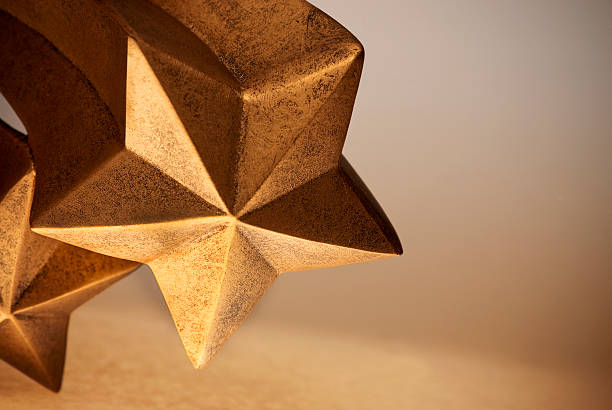 Cometa ouro ou Bronze forma de cinco chamou Crescendo Shooting Stars - fotografia de stock