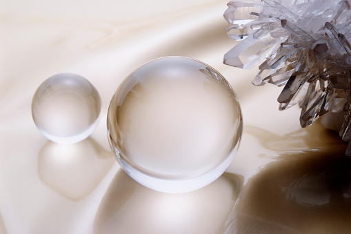 Closeup shot of a magic glass ball on the velvet cloth