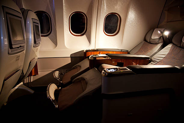 Business class reclined seats of airplane stock photo