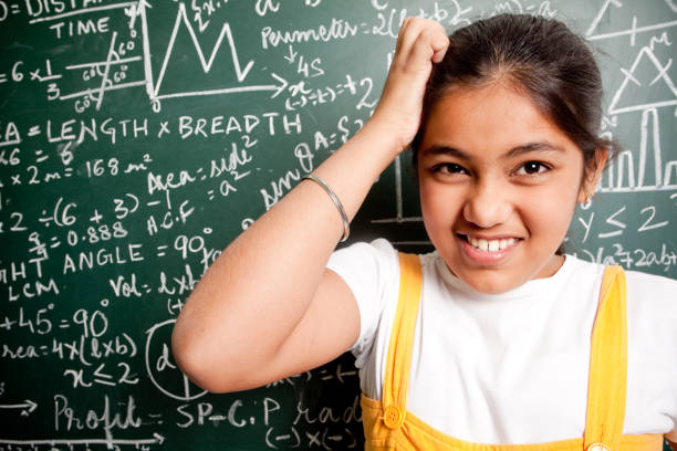 istock Confused Indian Girl Student with Mathematics Problems 157585201