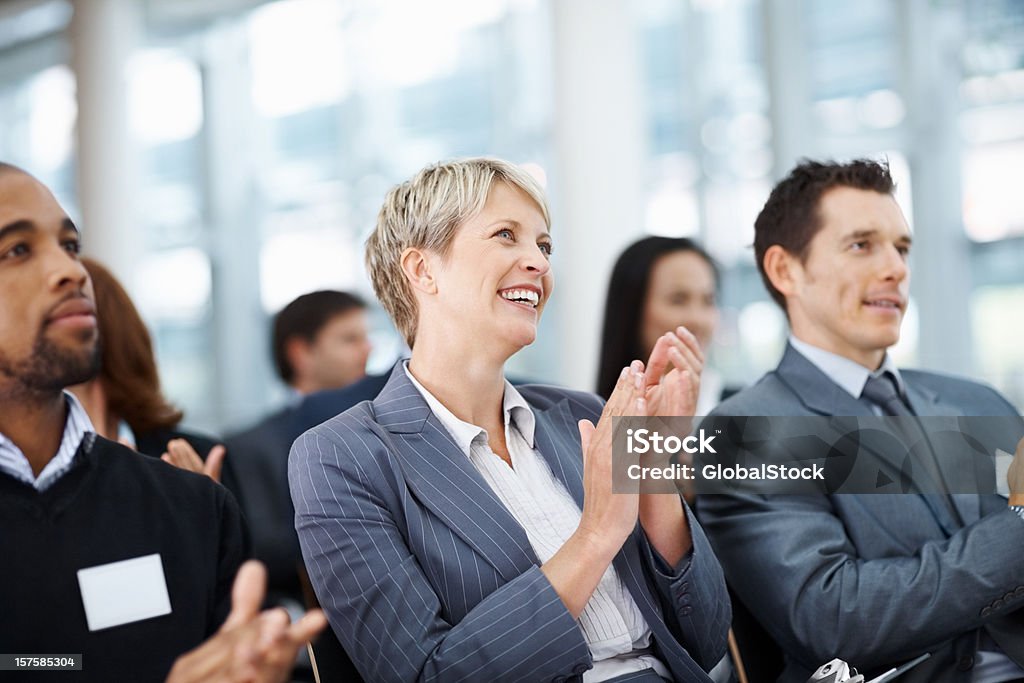 Business colleagues clapping her hand while at a seminar  Award Stock Photo