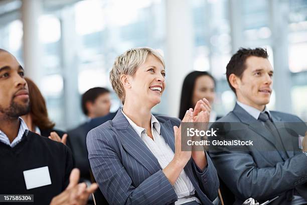 Business Colleagues Clapping Her Hand While At A Seminar Stock Photo - Download Image Now