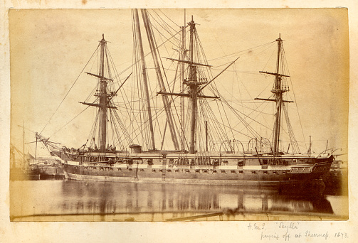 Old wooden ship in the bay. Fine art image canvas texture added.