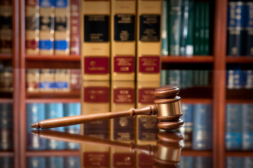 Wooden gavel on conference table in a law firm.