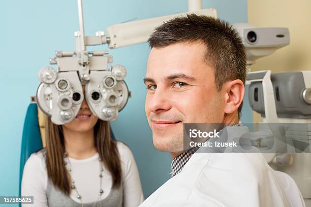 Optometrist Eye Exam Tonometer Stock Photo - Download Image Now - Doctor, Eye Exam, Looking Over Shoulder