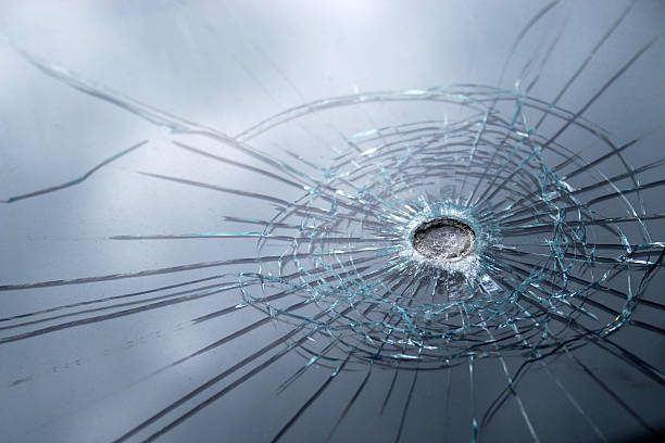 Broken bulletproof glass stock photo