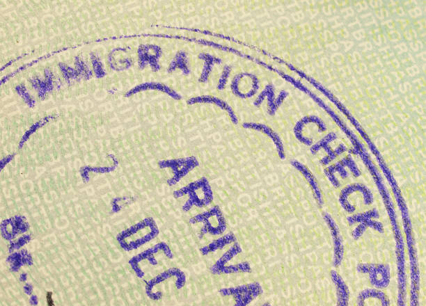 istock Immigration Arrival stamp in a British passport 157585682