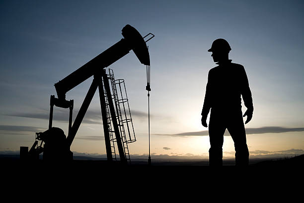 istock Oil Worker and Pumpjack 157585834