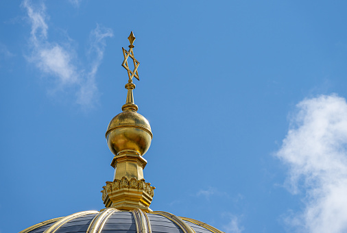 mosque muslim temple in low angle with golden dome