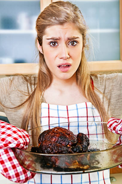 Teen learning to cook  funny thanksgiving stock pictures, royalty-free photos & images