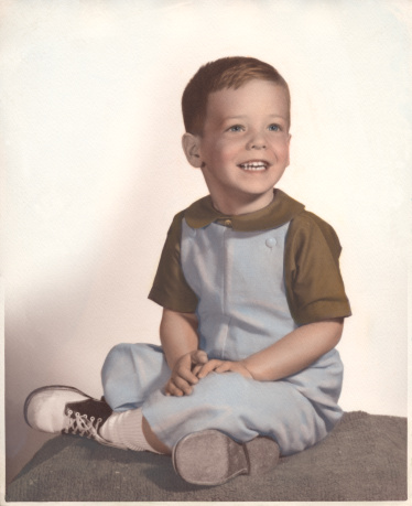 Circa 1964, hand tinted photograph of a 4 year old boy.
