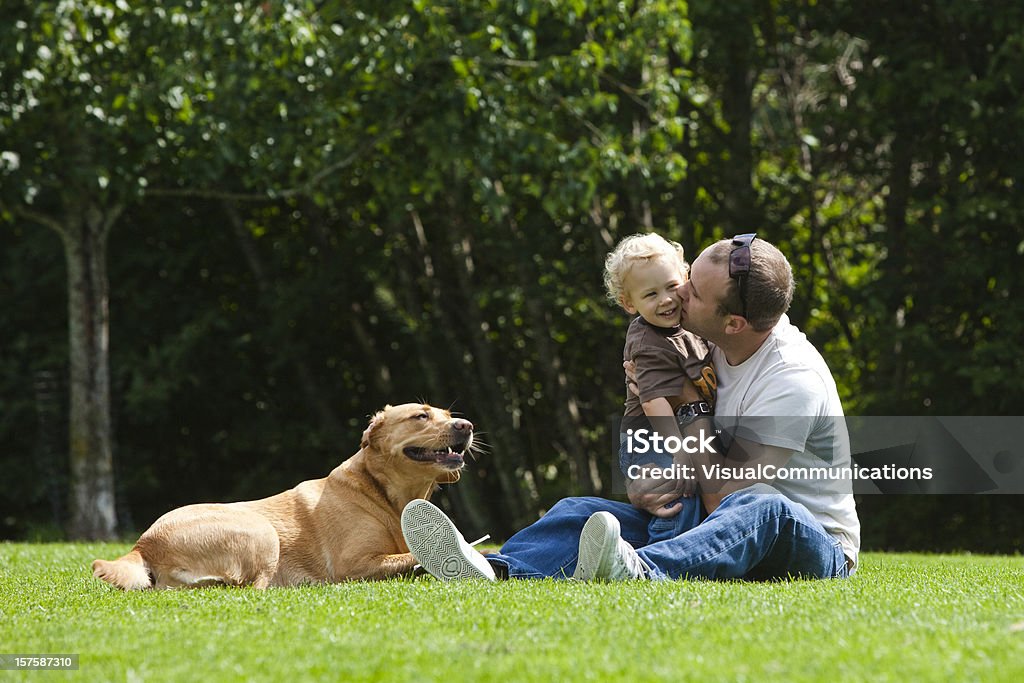 father and son playing in park.  12-17 Months Stock Photo