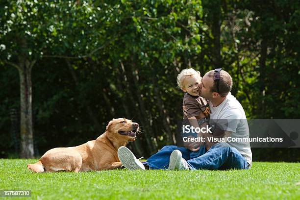 Father And Son Playing In Park Stock Photo - Download Image Now - 12-17 Months, Animal, Baby - Human Age