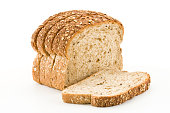 Detailed close-up of sliced grain bread on white background