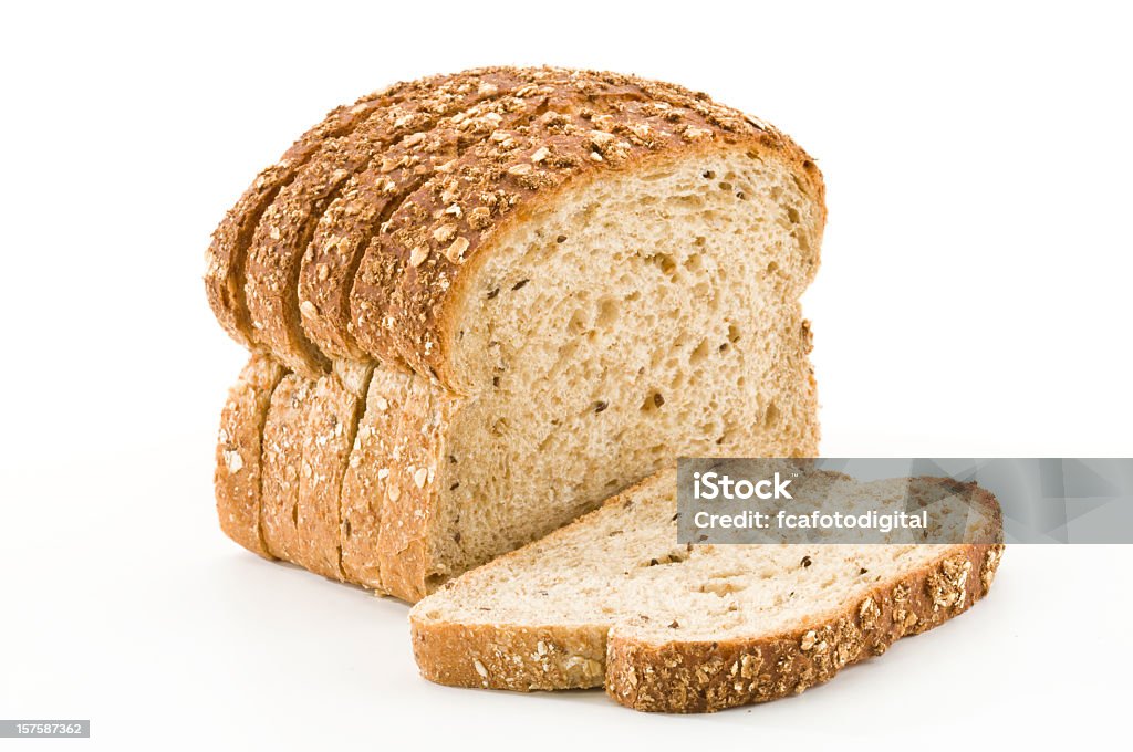 Detailed close-up of sliced grain bread on white background Sliced Bread on White Backgroundhttp://i1215.photobucket.com/albums/cc503/carlosgawronski/FoodonWhite.jpg Bread Stock Photo