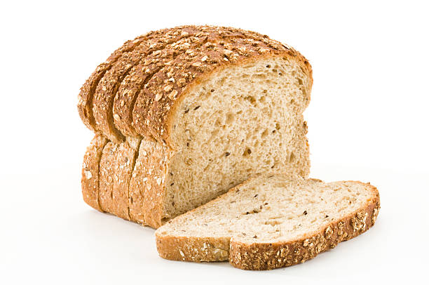 Detailed close-up of sliced grain bread on white background Sliced Bread on White Backgroundhttp://i1215.photobucket.com/albums/cc503/carlosgawronski/FoodonWhite.jpg whole wheat stock pictures, royalty-free photos & images