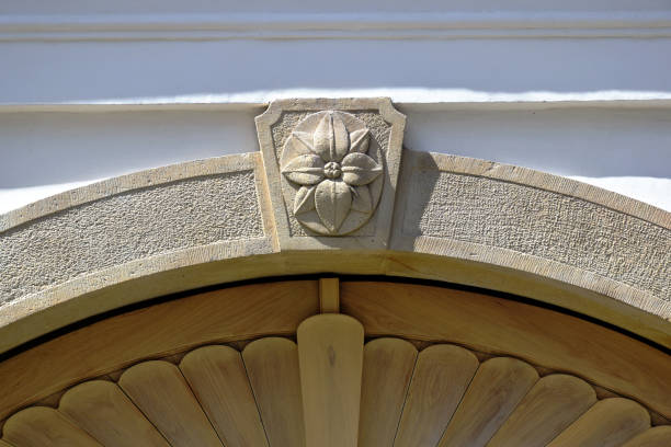 istock decorative stone arched beam above wood gate. ornamental carved keystone 1575877066