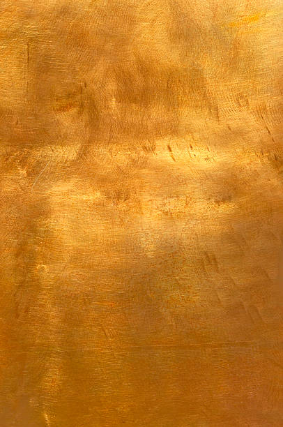 Abstract golden copper or bronze metal background XL Brushed brown-golden copper or bronze surface, with visible brush strokes. The sheet metal has an appealing cloudy, wavy texture. Horizontal orientation. The image has been shot outdoors during natural day light, full frame and close up. Ideal for backgrounds. The dimensions of the photo are 2796 x 4210 px. bronze coloured stock pictures, royalty-free photos & images