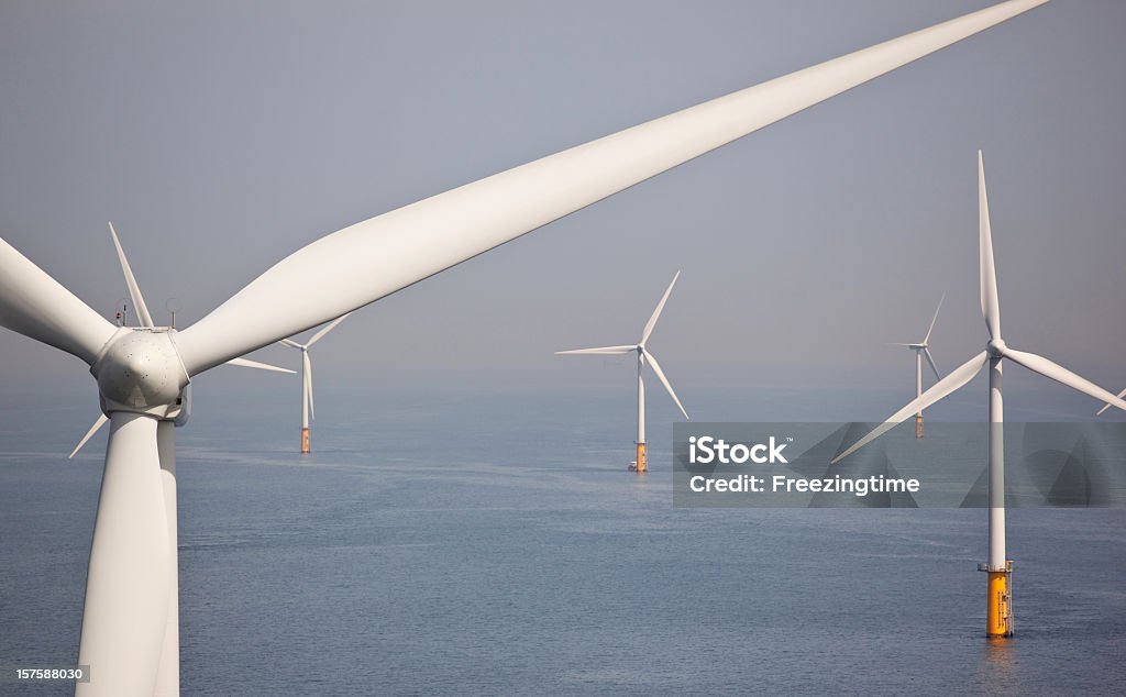 Offshore wind park, large white turbines Turbines in an offshore wind park

You can find more of my industrial shots here:
[url=http://www.istockphoto.com/search/lightbox/884279#10f4a773][img]http://freezingtime.com/istock/Industry.jpg[/img][/url]
You can find more of my Green Energy shots here:
[url=http://www.istockphoto.com/search/lightbox/8329829#110624b9][img]http://www.freezingtime.com/storage/istock/Green.jpg[/img][/url]
You can find more of my aerial views here:
[url=http://www.istockphoto.com/search/lightbox/8393695#11b32db1][img]http://www.freezingtime.com/storage/istock/Aerial.jpg[/img][/url] Carbon Footprint Stock Photo
