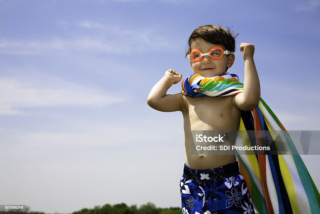 Cute Boy With Swimwear On Flexing Muscles  Child Stock Photo