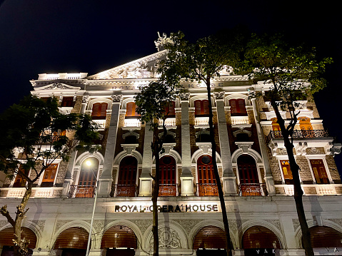 Royal Opera House, Mumbai, India - March, 05 2023: Stock photo showing close-up, night-time view of the illuminated facade of the Royal Opera House, India's only surviving opera house.