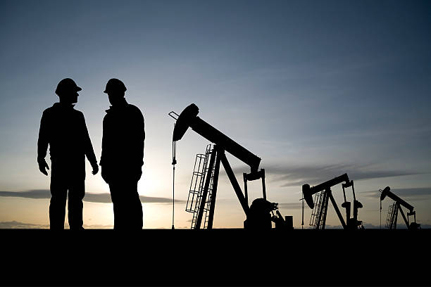 istock Workers in an Oil Field 157588379