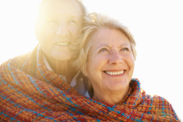 istock Cute old couple smiling wrapped in a shawl 157588420