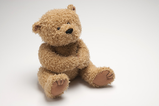 Detailed image of a stuffed bear. Image has copy space for your text. Useful for any themes dealing with children.