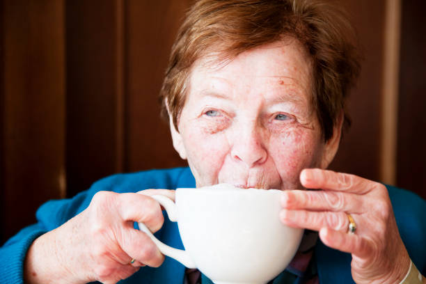 istock senior woman drinking coffee 157588996