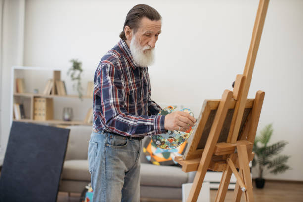 istock Elderly person improving artistic skills in studio interior 1575890226