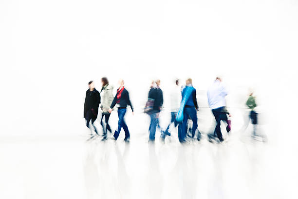 Commuters Walking in Corridor, Blurred Motion pedestrians walking in a modern interior, high key mall walker stock pictures, royalty-free photos & images