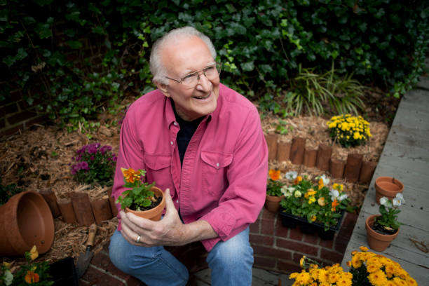 istock Active Senior Man in Garden with Flowers 157589228