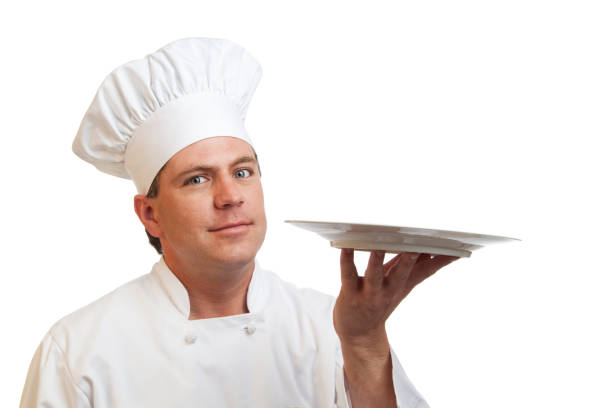 istock Cook with white chef hat and uniform holding a plate 157589280