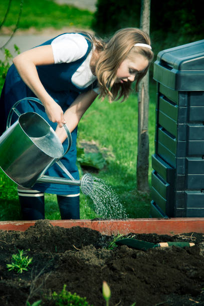 istock Young girl gardening. 157589296