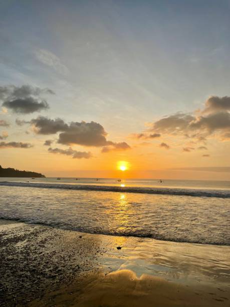 istock Sunset at Jimbaran Beach Bali Indonesia 1575895173