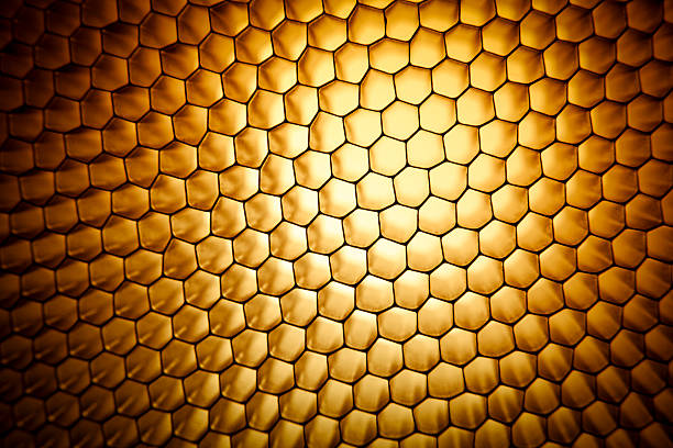 Gold yellow honeycomb grid mesh background texture Gold yellow honeycomb grid mesh background texture honeycomb pattern photos stock pictures, royalty-free photos & images