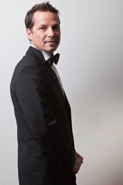 istock Young man in tuxedo with black tie 157590026