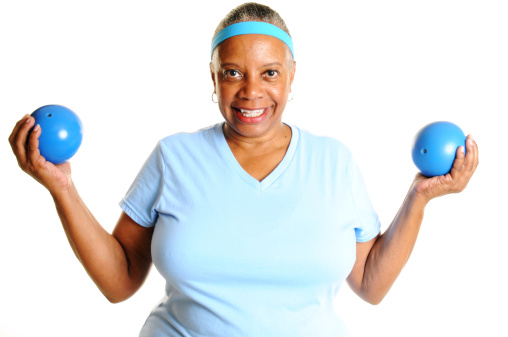 Mature Black Woman Lifting Weight Balls